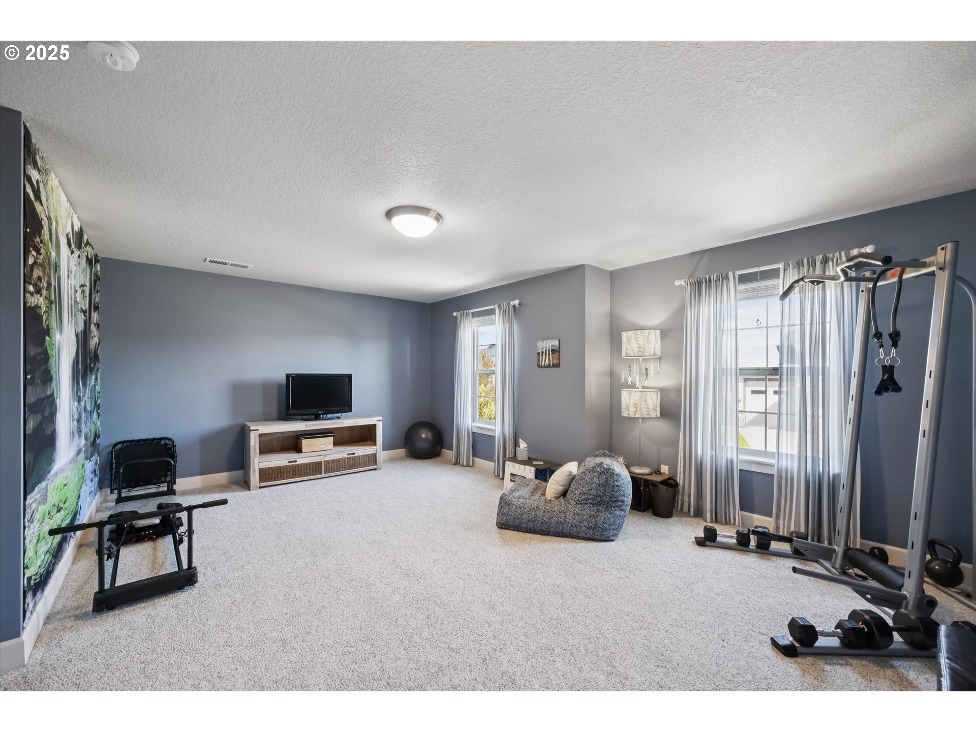 2440 Heather Way Forest Grove, OR 97116 - Photo 17 of 24 a living room with furniture a flat screen tv and a window