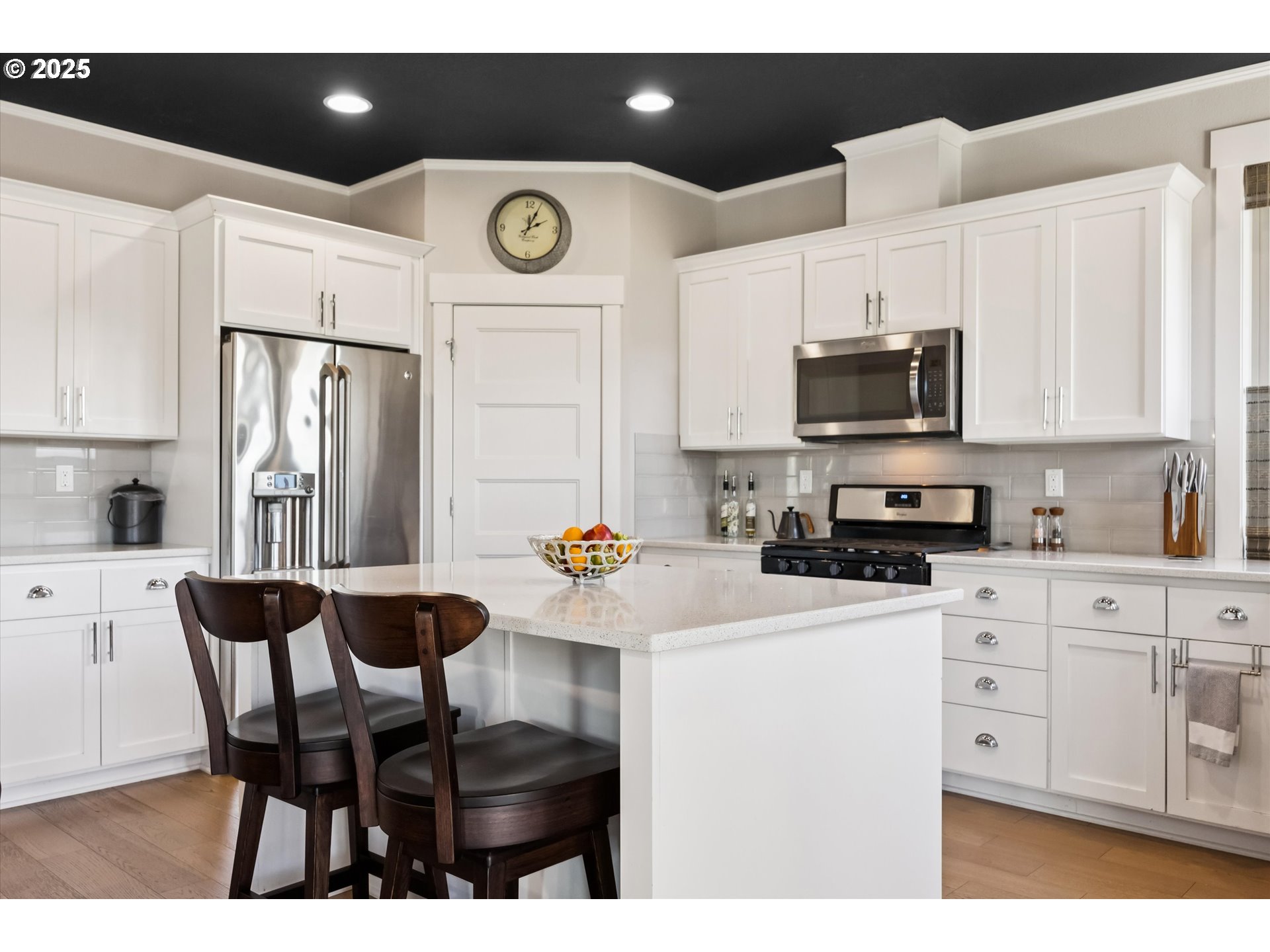 2440 Heather Way Forest Grove, OR 97116 - Photo 6 of 24 a kitchen with stainless steel appliances a sink a stove a refrigerator cabinets and dining table