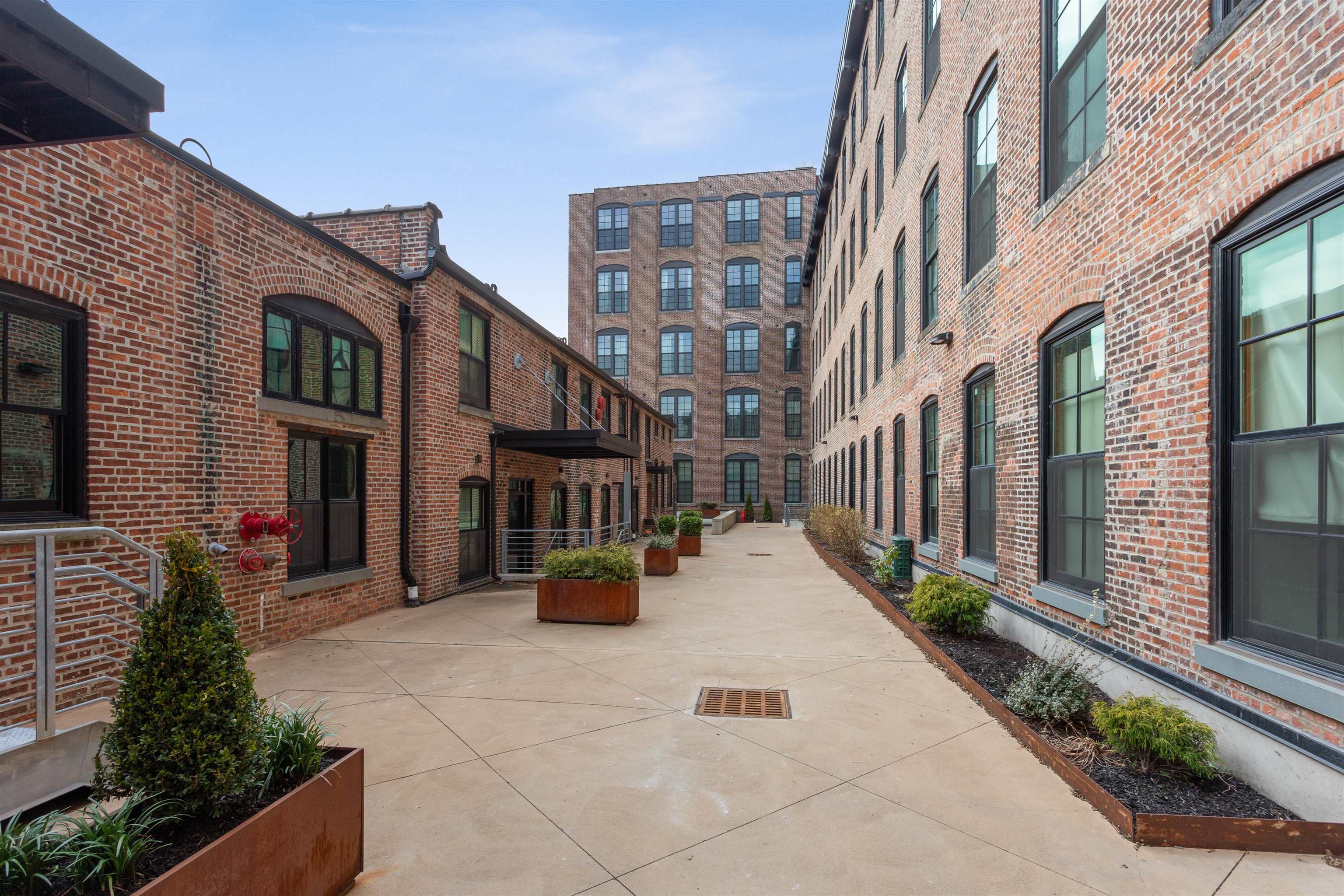 154 Ave East, Unit B407 Bayonne, NJ 07002 - Photo 16 of 19 a view of a building with many windows