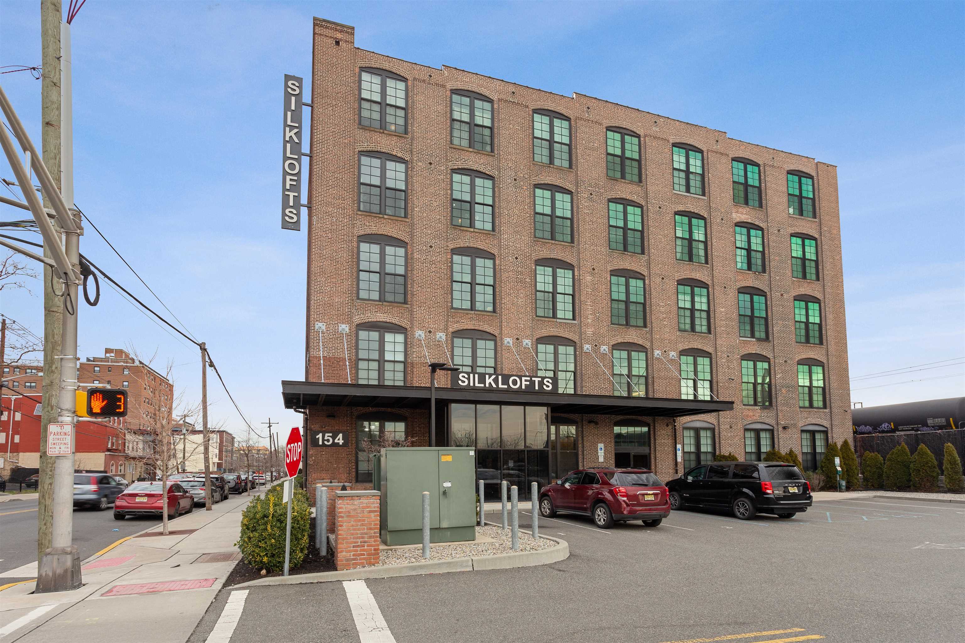 154 Ave East, Unit B407 Bayonne, NJ 07002 - Photo 17 of 19 a car parked in front of a building