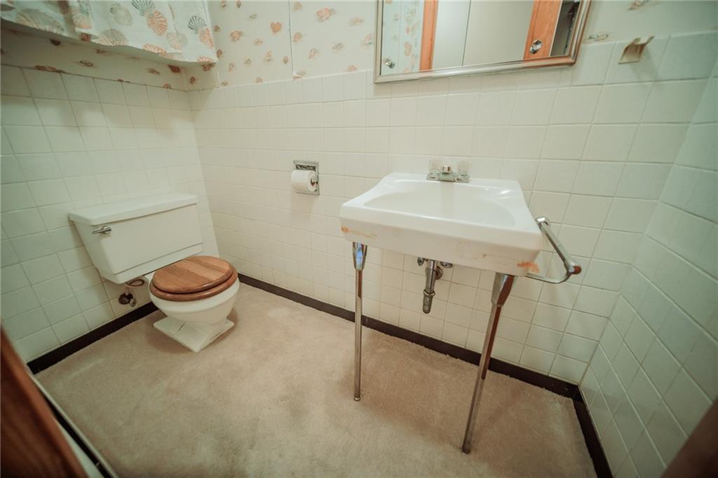 786 Wheatland Road West Middlesex, PA 16159 - Photo 8 of 24 Make this lovely bath your own. White ceramic walls with one of a kind sink.