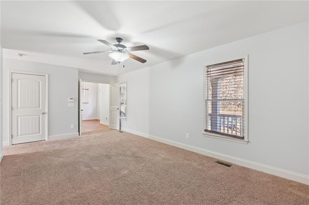 102 Oak Ridge Trail White, GA 30184 - Photo 25 of 31 a view of an empty room with a window
