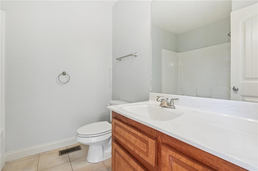102 Oak Ridge Trail White, GA 30184 - Photo 29 of 31 a bathroom with a sink a toilet and a mirror