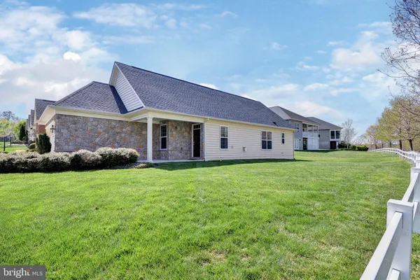 a view of a house with a back yard
