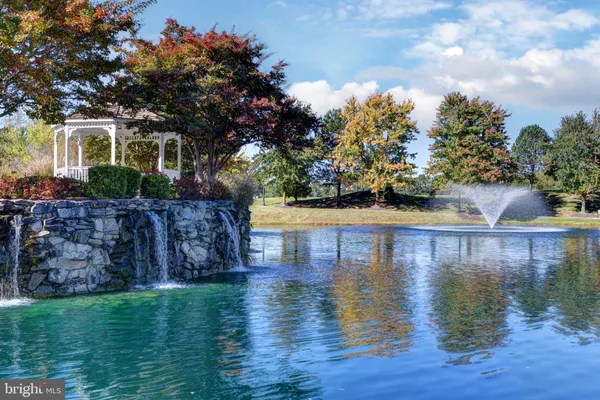 a view of a lake with a house in the background