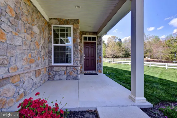 a front view of a house with a porch