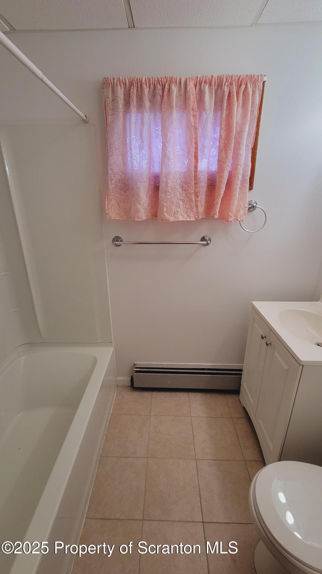 712 Alder Street, Unit FIRST Scranton, PA 18505 - Photo 15 of 18 a bathroom with a bathtub