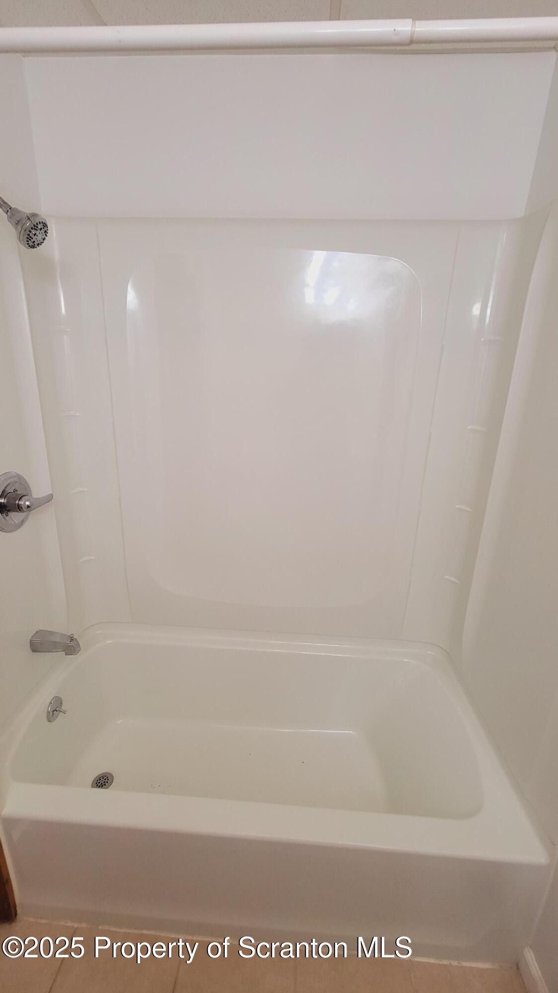 712 Alder Street, Unit FIRST Scranton, PA 18505 - Photo 17 of 18 a bathroom with a bathtub