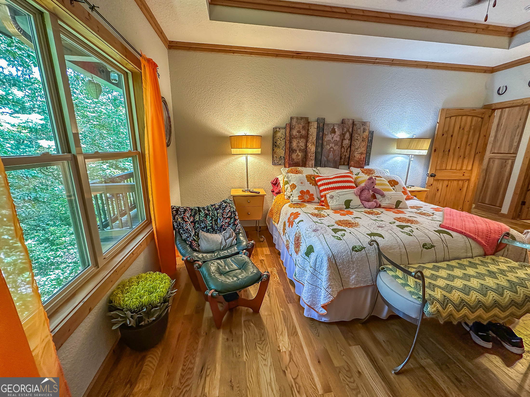 181 Morgan Ridge Court Young Harris, GA 30582 - Photo 14 of 37 a bed sitting in a bedroom next to a window