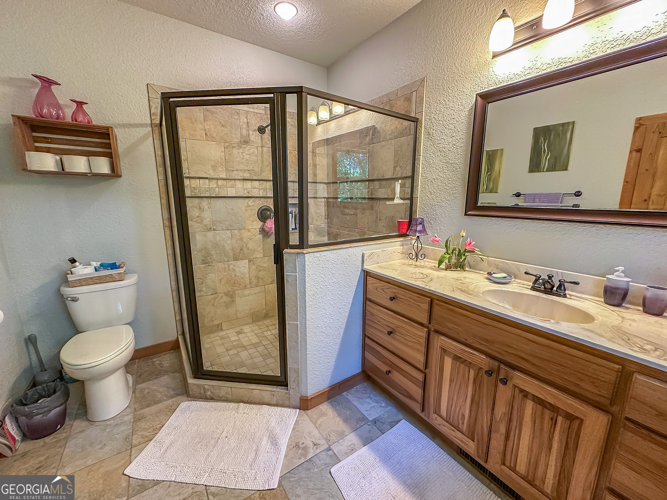 181 Morgan Ridge Court Young Harris, GA 30582 - Photo 18 of 37 a bathroom with a toilet sink and mirror