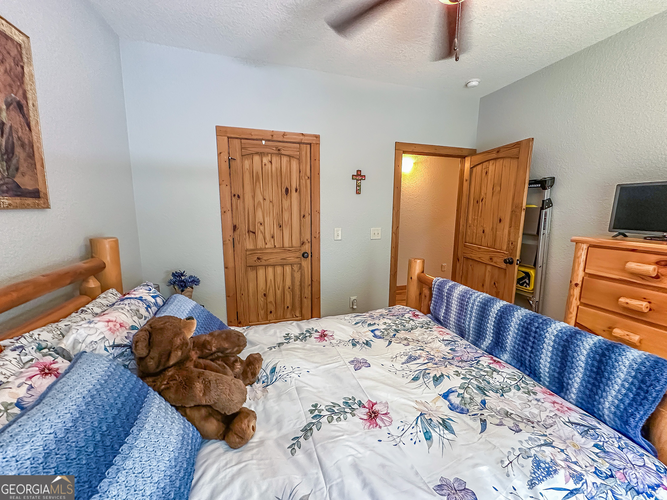 181 Morgan Ridge Court Young Harris, GA 30582 - Photo 21 of 37 a bedroom with a bed and wooden floor