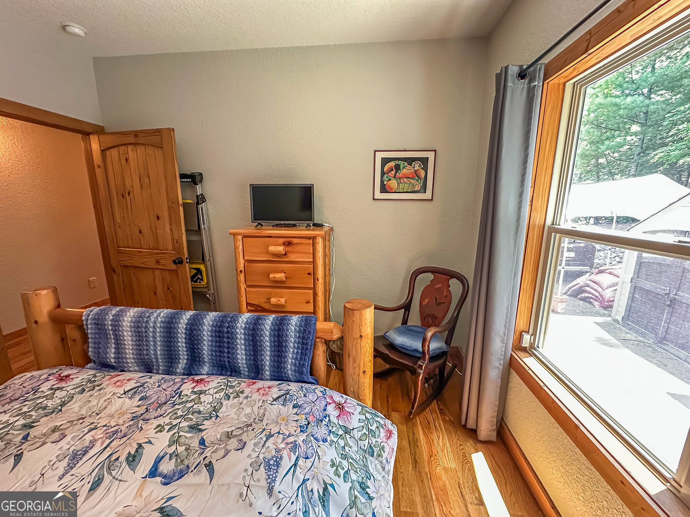 181 Morgan Ridge Court Young Harris, GA 30582 - Photo 22 of 37 a bed room with a bed and a chair