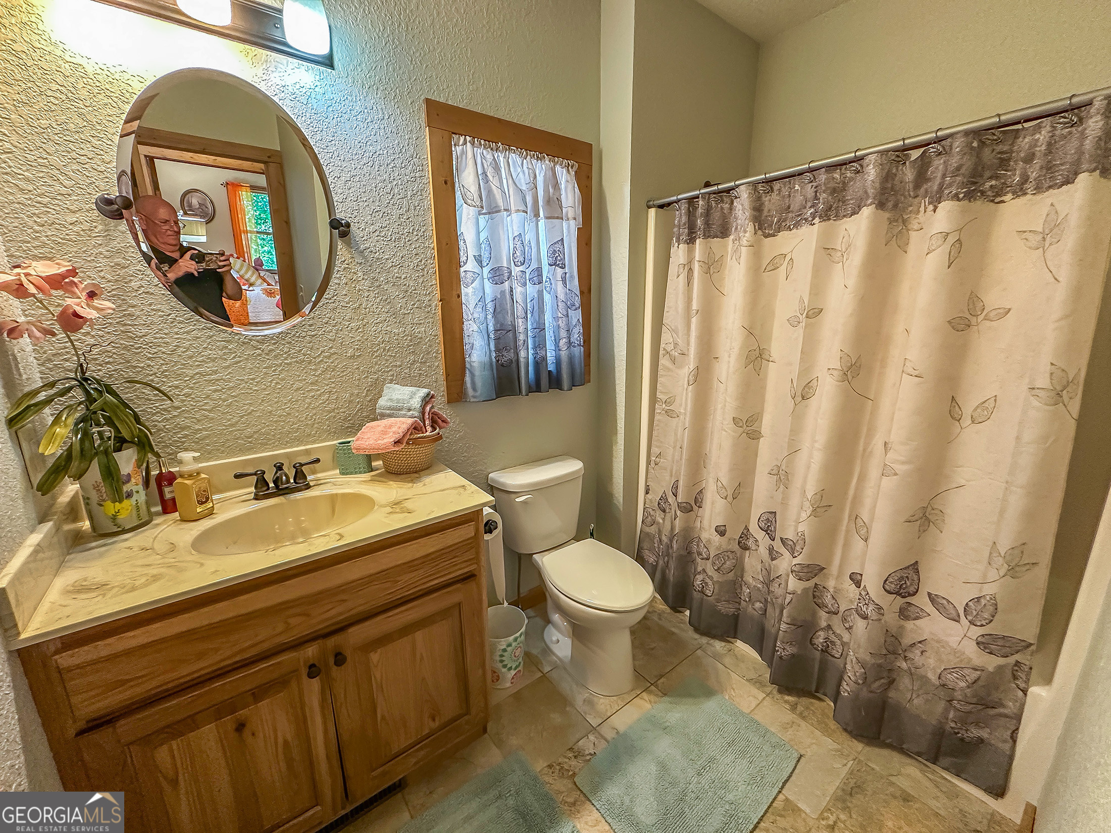 181 Morgan Ridge Court Young Harris, GA 30582 - Photo 23 of 37 a bathroom with a sink and a mirror