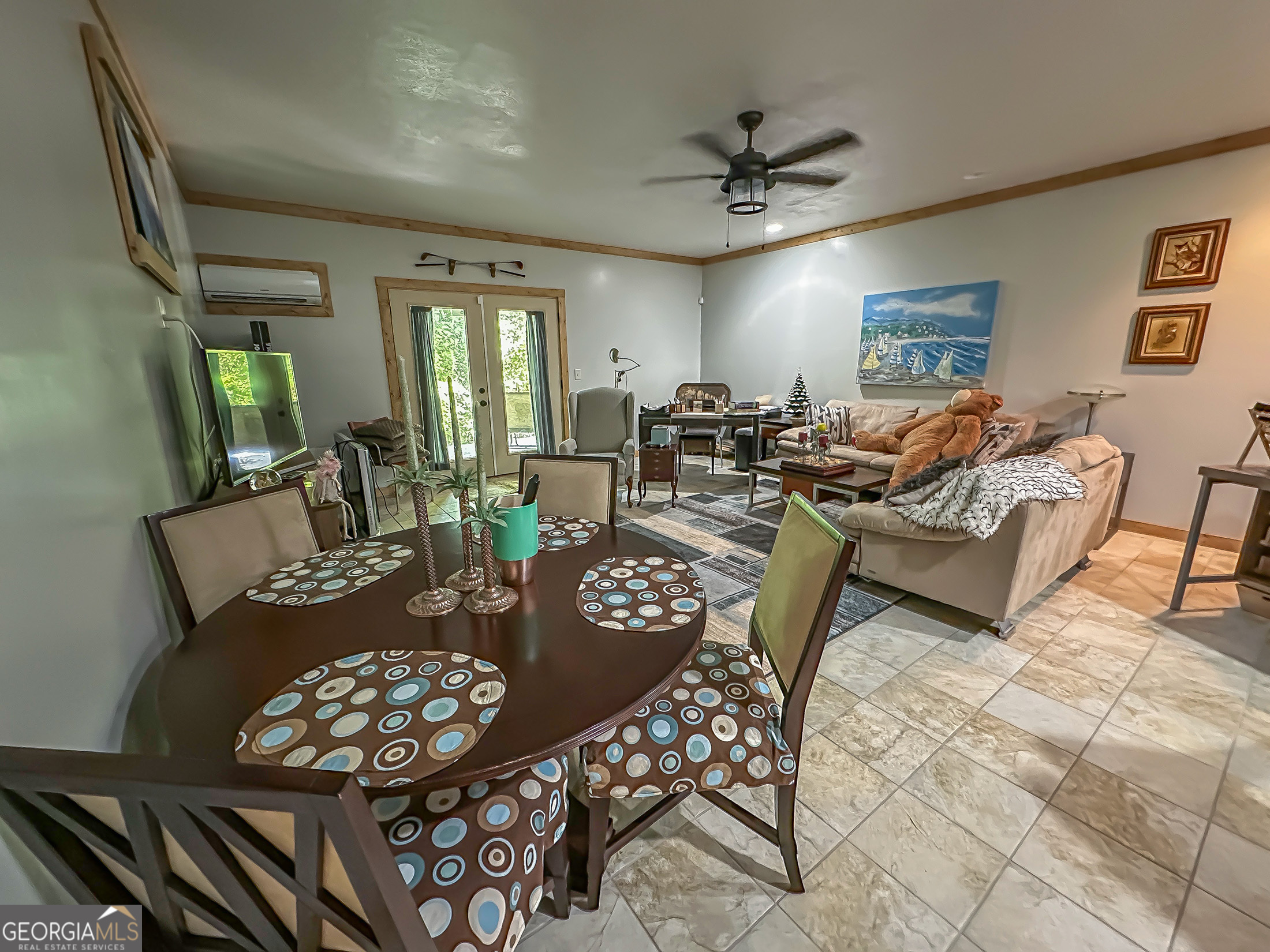 181 Morgan Ridge Court Young Harris, GA 30582 - Photo 25 of 37 a view of a livingroom and dining room with furniture wooden floor a rug and a chandelier