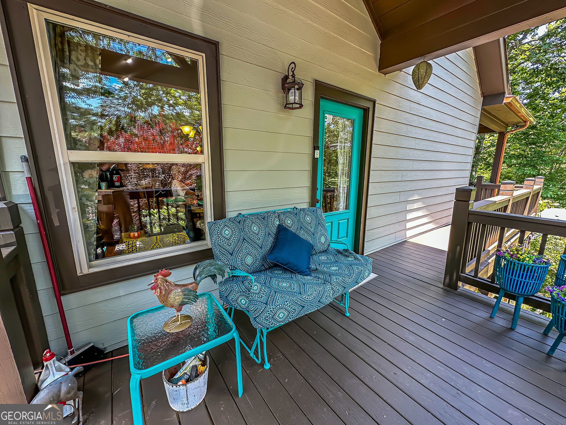 181 Morgan Ridge Court Young Harris, GA 30582 - Photo 3 of 37 a view of a deck with chairs and wooden floor