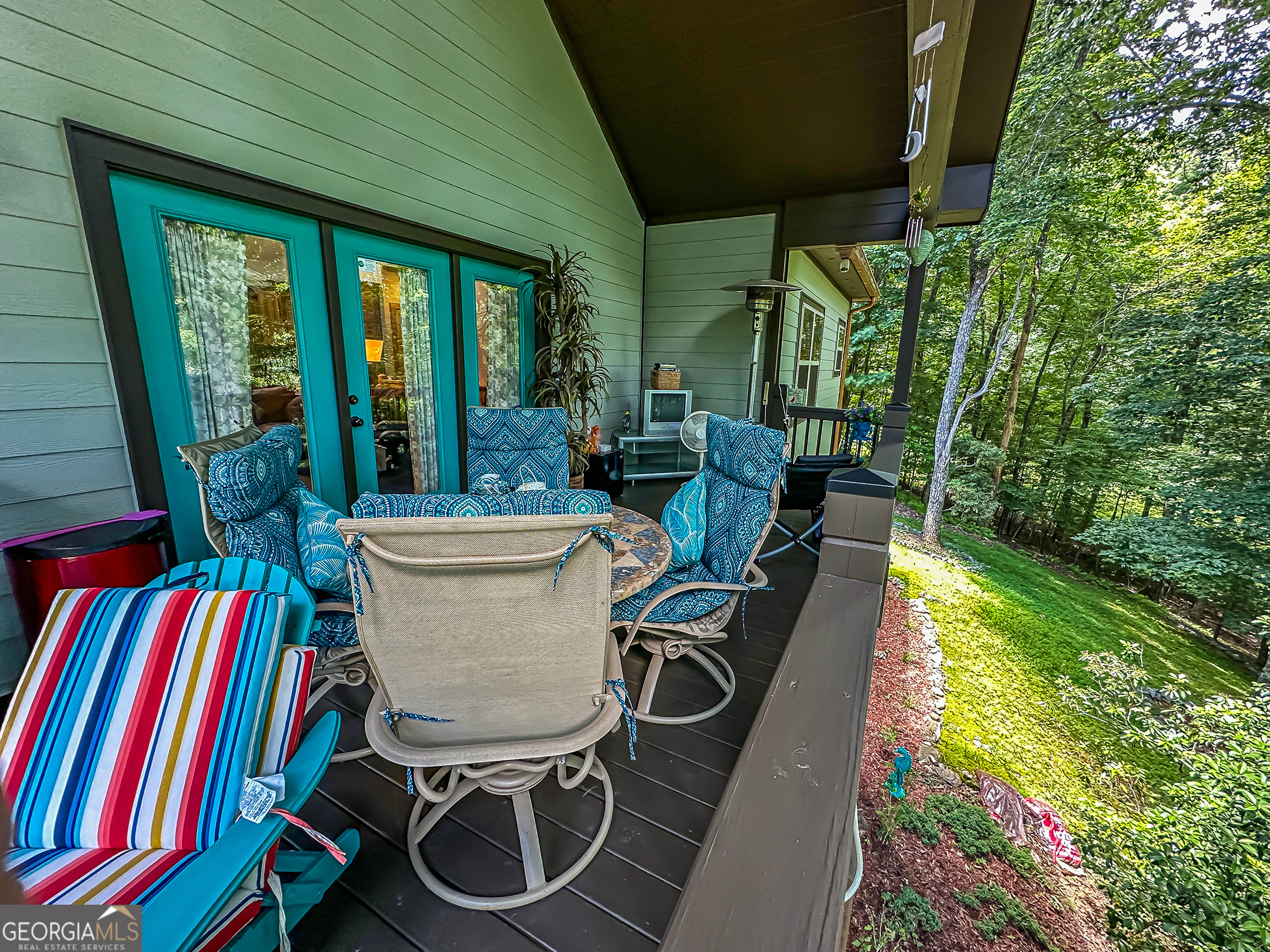 181 Morgan Ridge Court Young Harris, GA 30582 - Photo 6 of 37 a view of a patio with table and chairs barbeque potted plants and large tree