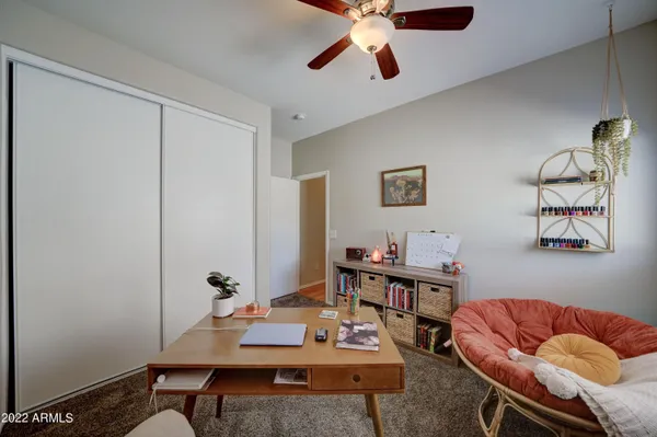 a view of a workspace with furniture