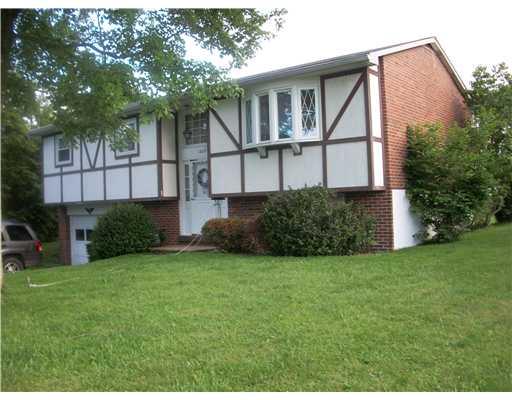 1827 Cowling Road Scottdale, PA 15683 - Photo 1 of 10 Exterior Front. Lovely level yard- nice bay window in living room.