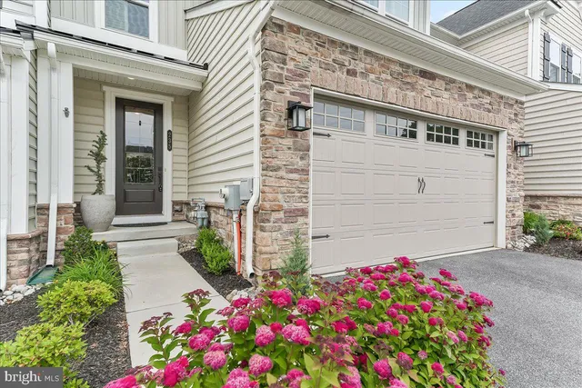a flower plants in front of a house