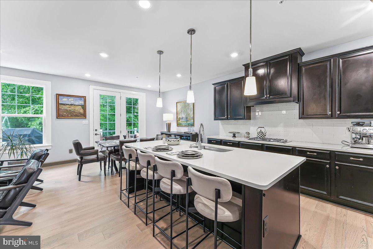 235 Ponds Edge Drive Media, PA 19063 - Photo 9 of 47 Side views of kitchen, dining and outdoor views.