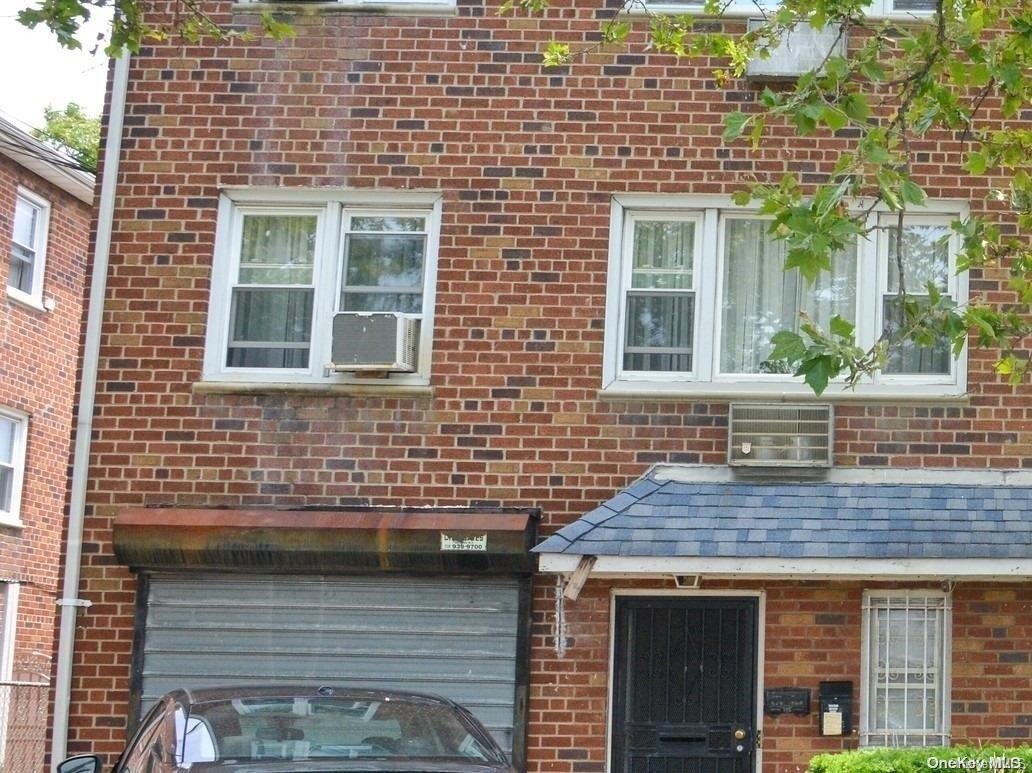 555 Eldert Lane Brooklyn, NY 11208 - Photo 2 of 6 a front view of a house with glass windows