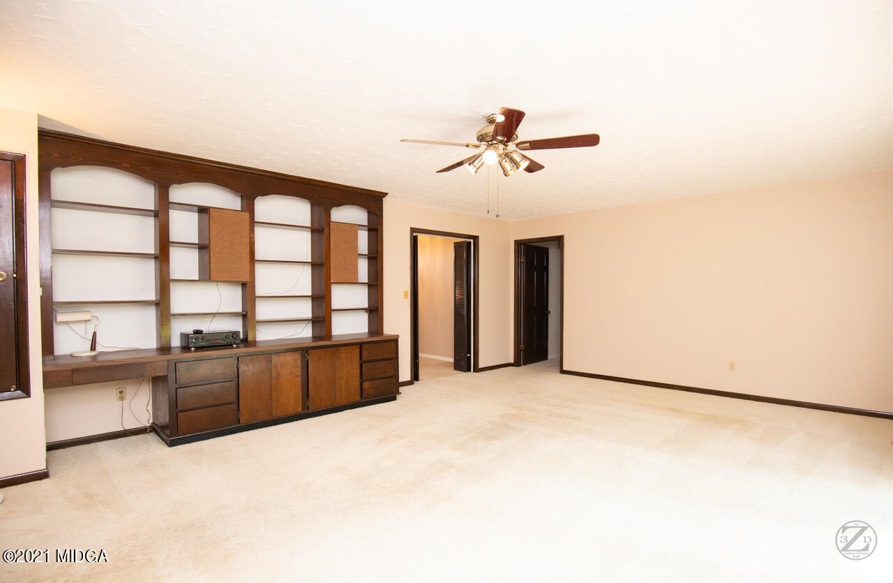 1027 Country Club Road Perry, GA 31069 - Photo 13 of 55 a view of an empty room with a window