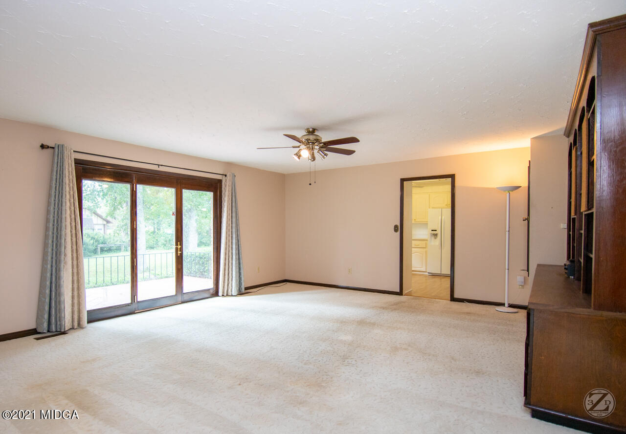 1027 Country Club Road Perry, GA 31069 - Photo 15 of 55 a view of an empty room with a window