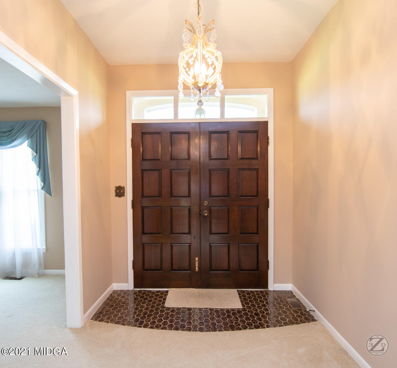 1027 Country Club Road Perry, GA 31069 - Photo 16 of 55 a view of a hallway with wooden floor and a chandelier