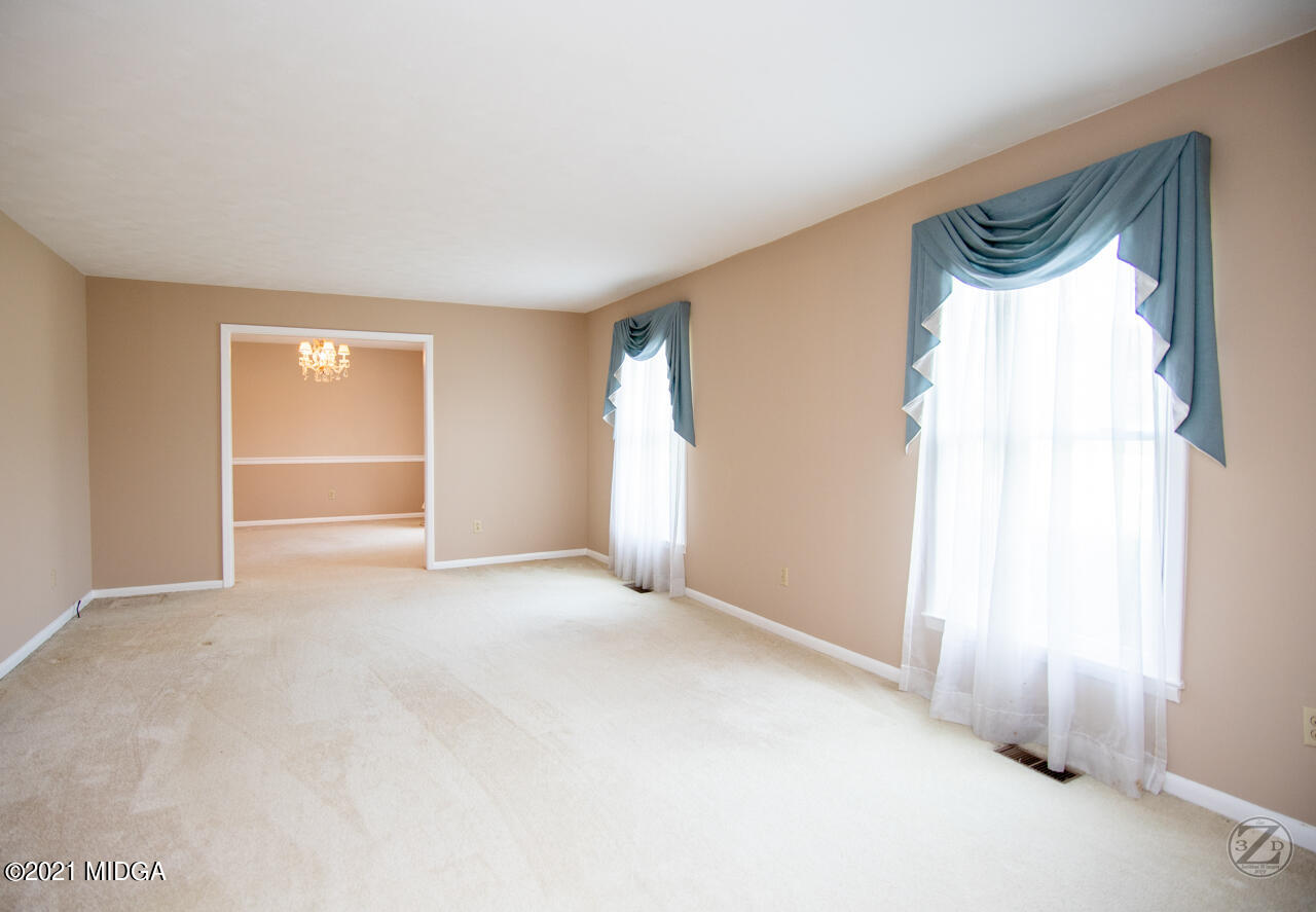 1027 Country Club Road Perry, GA 31069 - Photo 19 of 55 a view of an empty room and a window