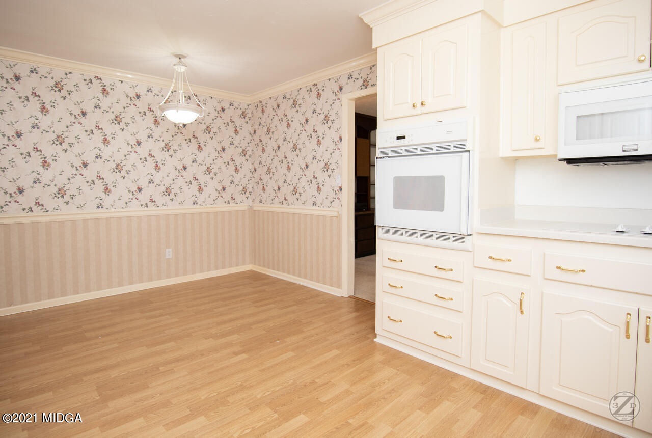 1027 Country Club Road Perry, GA 31069 - Photo 28 of 55 a view of cabinets with wooden floor