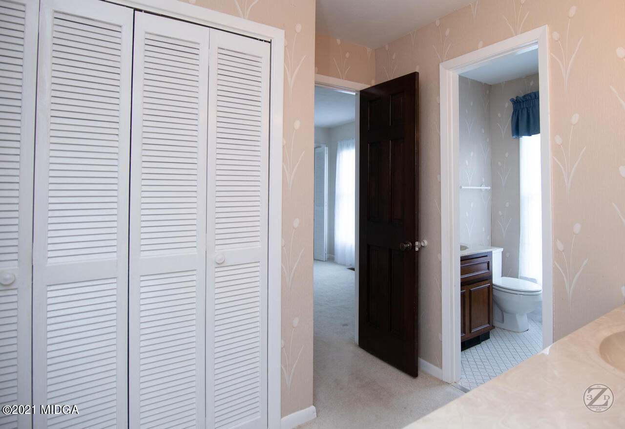 1027 Country Club Road Perry, GA 31069 - Photo 35 of 55 a view of a bathroom with a shower