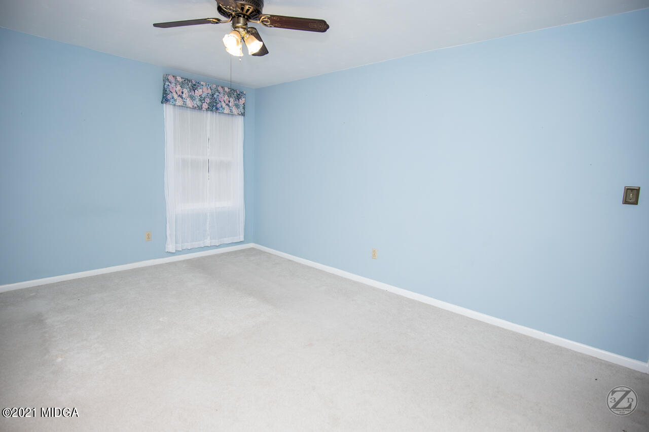 1027 Country Club Road Perry, GA 31069 - Photo 39 of 55 wooden floor in an empty room