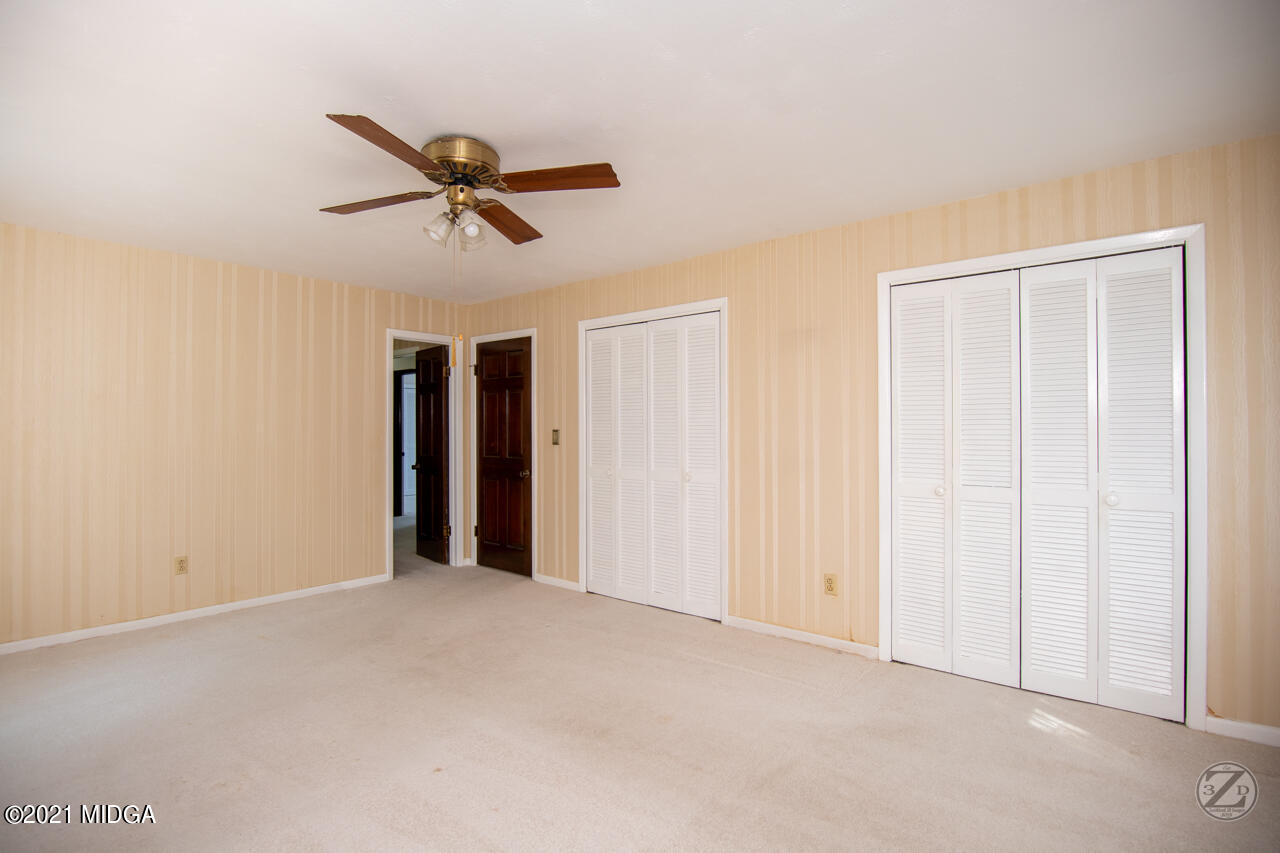 1027 Country Club Road Perry, GA 31069 - Photo 51 of 55 a view of a livingroom with a ceiling fan & window