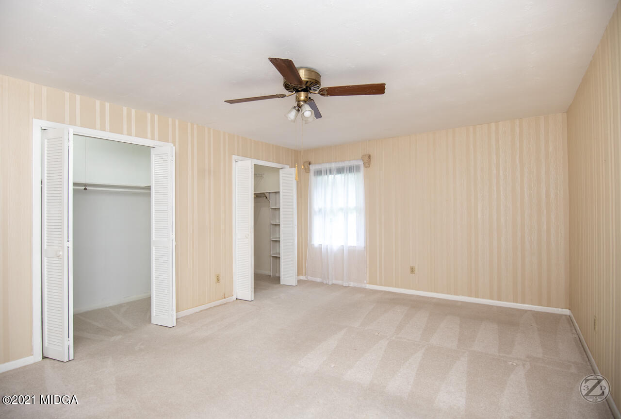 1027 Country Club Road Perry, GA 31069 - Photo 52 of 55 a view of an empty room with a window