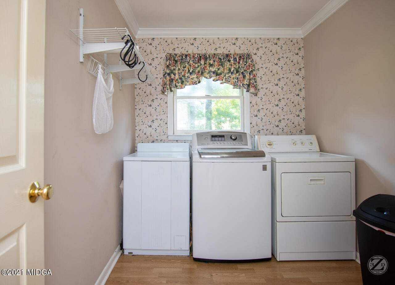 1027 Country Club Road Perry, GA 31069 - Photo 53 of 55 a utility room with dryer and washer