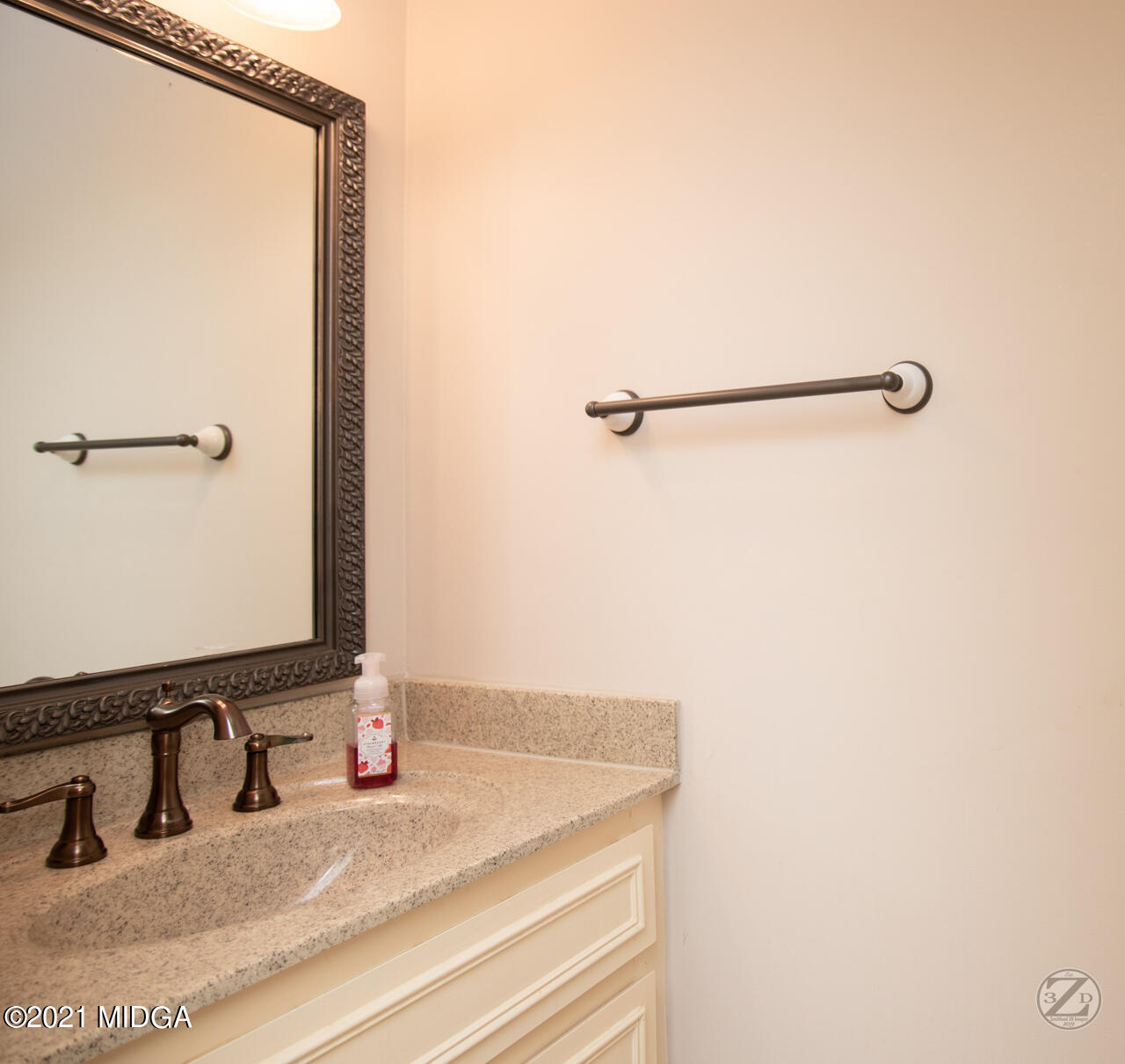 1027 Country Club Road Perry, GA 31069 - Photo 54 of 55 a bathroom with a sink and a mirror