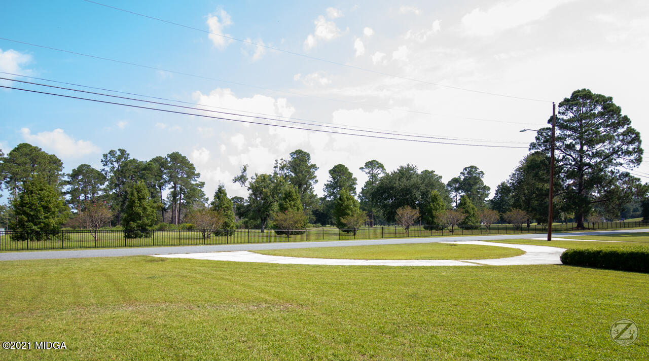 1027 Country Club Road Perry, GA 31069 - Photo 55 of 55 a view of a swimming pool with a yard