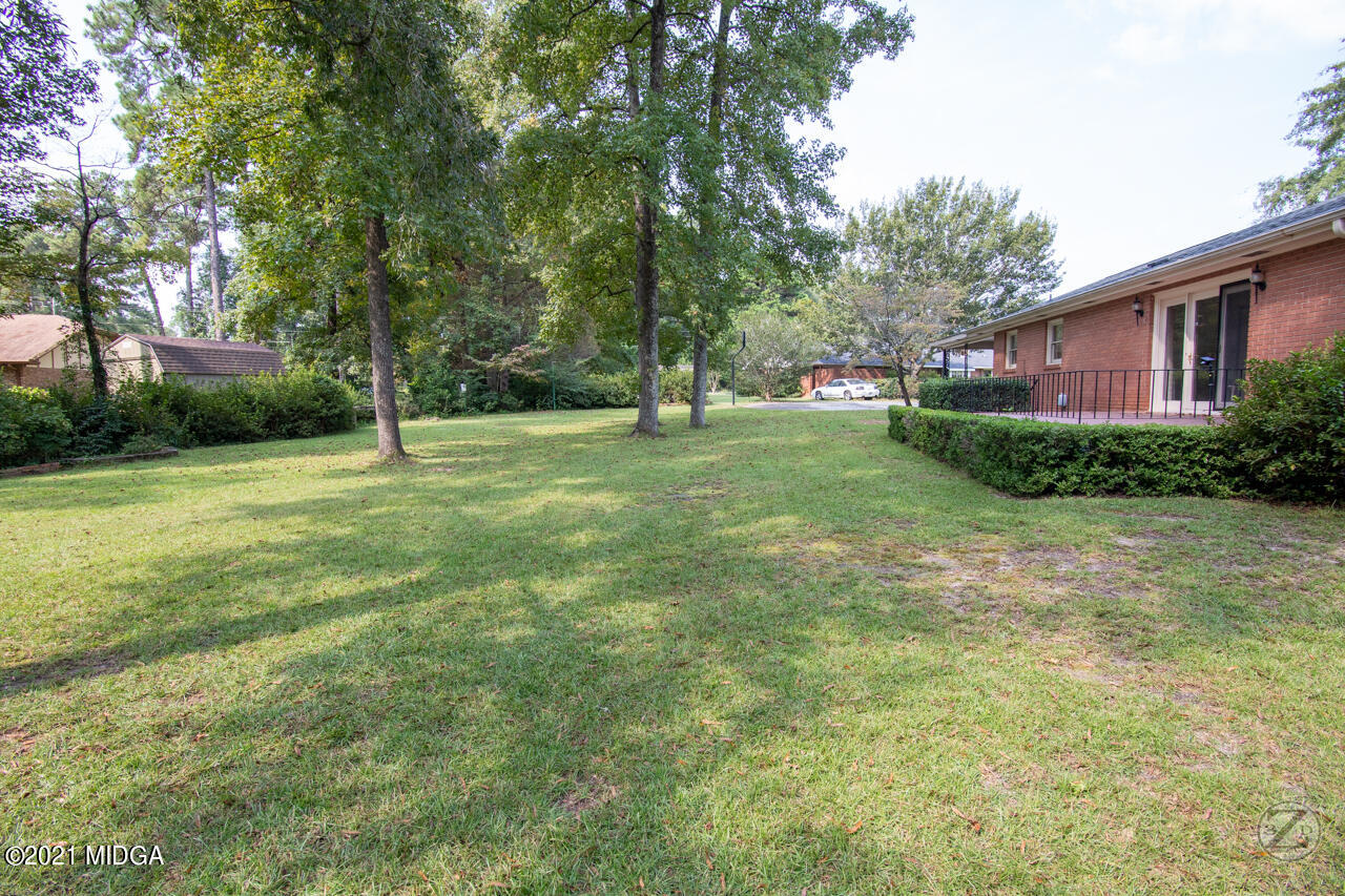 1027 Country Club Road Perry, GA 31069 - Photo 7 of 55 a view of a house with a backyard