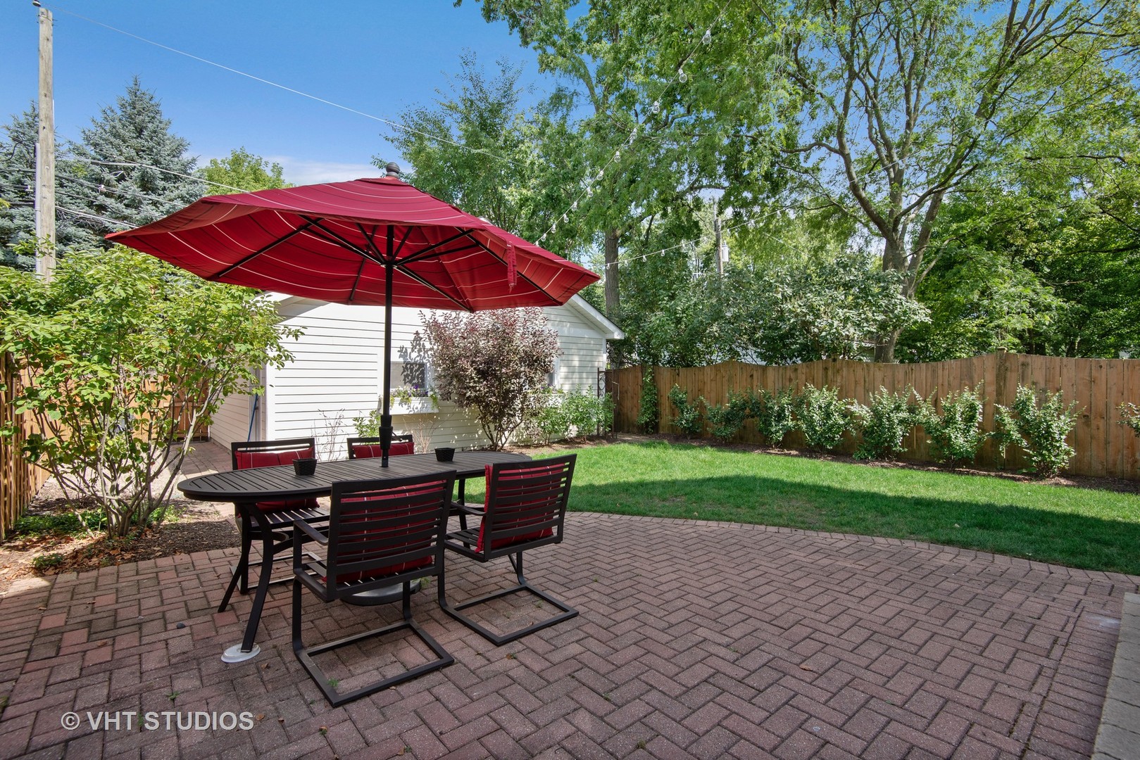 2121 Forestview Road Evanston, IL 60201 - Photo 27 of 35 a view of a table and chairs under an umbrella