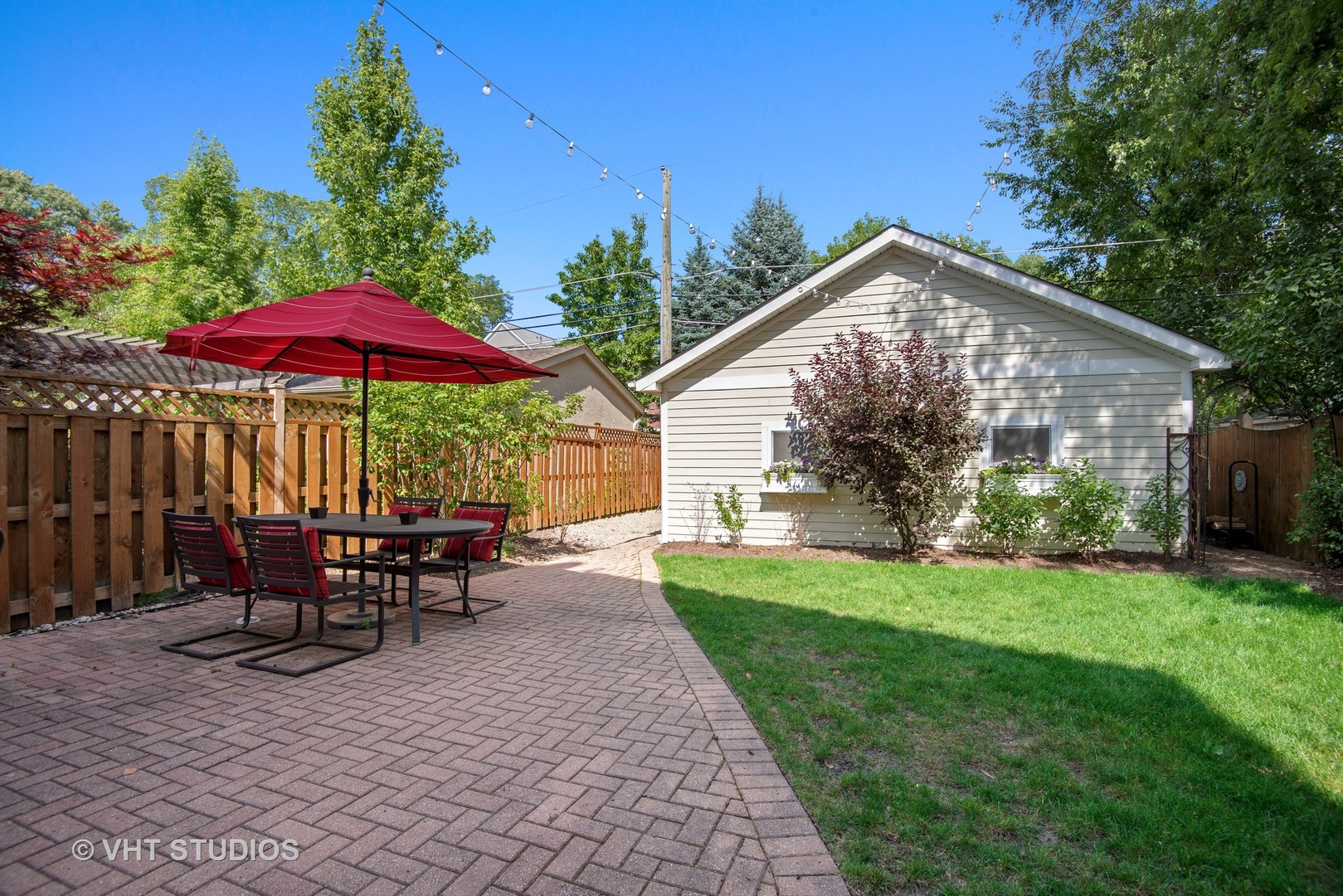 2121 Forestview Road Evanston, IL 60201 - Photo 29 of 35 a view of a house with backyard sitting area and garden