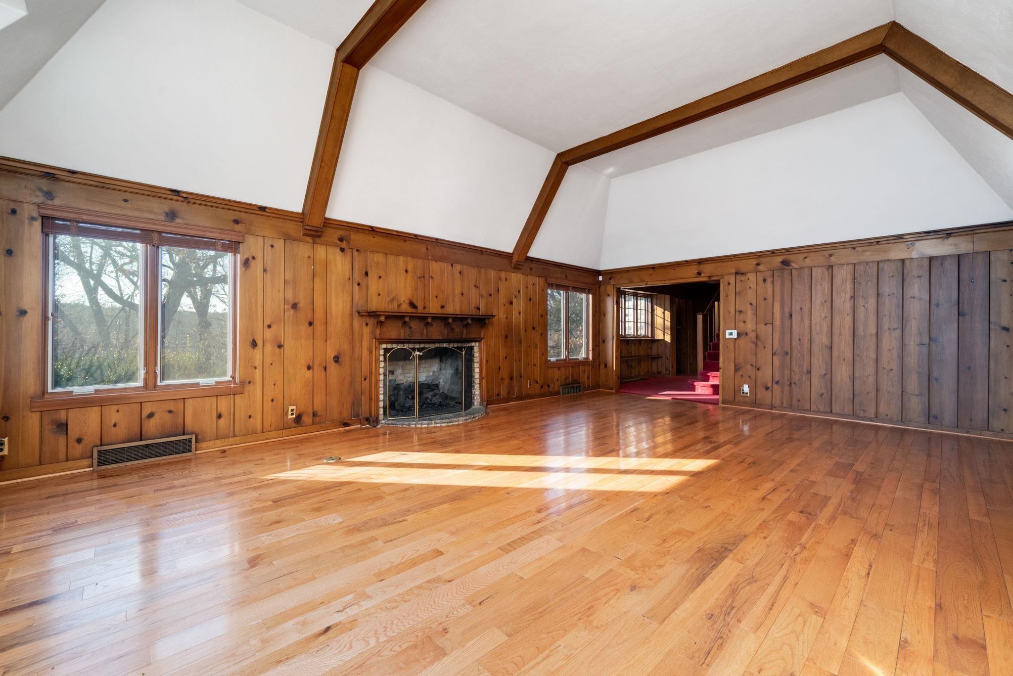 959 North River Road Oregon, IL 61061 - Photo 14 of 63 a view of empty room with wooden floor and fireplace