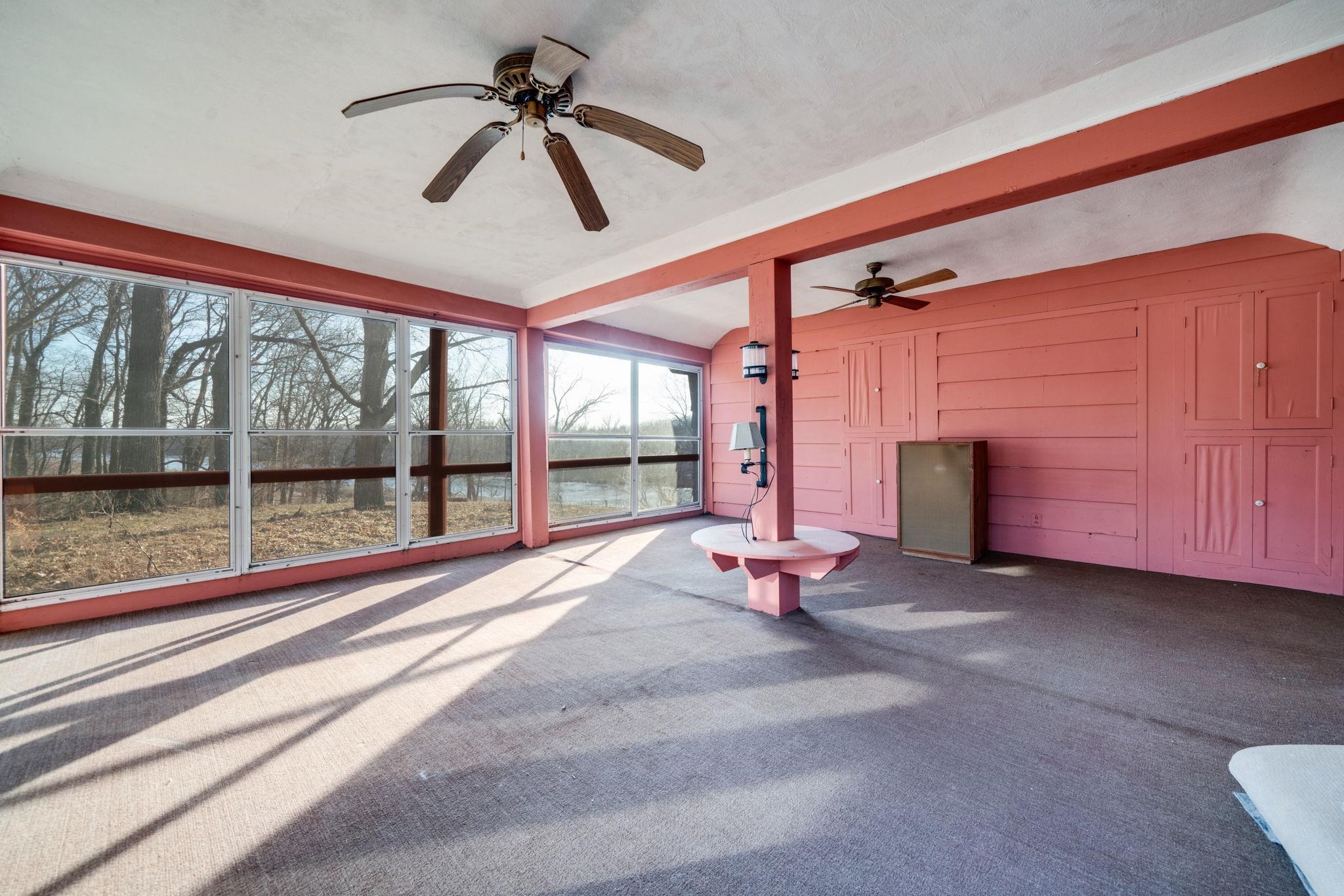 959 North River Road Oregon, IL 61061 - Photo 19 of 63 a view of room with wooden floor and ceiling fan