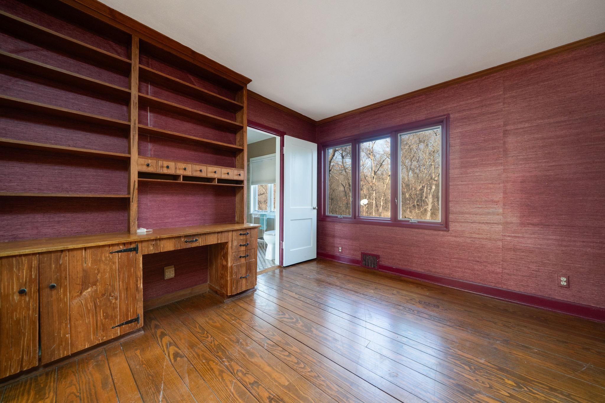 959 North River Road Oregon, IL 61061 - Photo 32 of 63 an empty room with wooden floor and windows