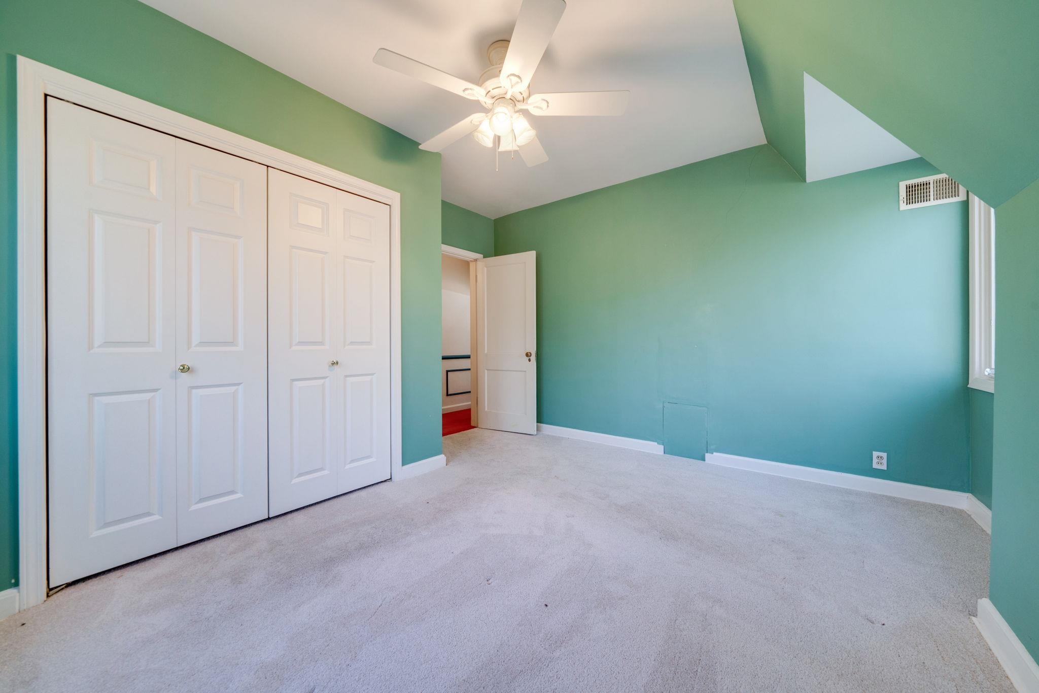 959 North River Road Oregon, IL 61061 - Photo 40 of 63 an empty room with closet and a ceiling fan