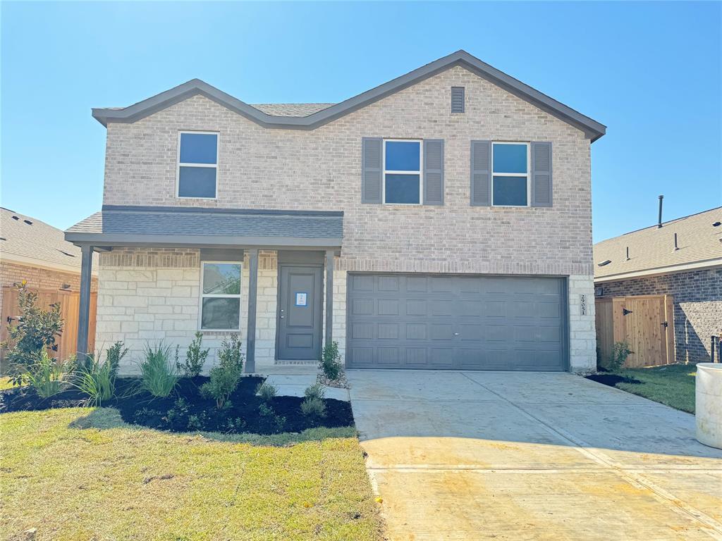 29003 Rustic Windmill Way Hockley, TX 77447 - Photo 1 of 17 a front view of a house with garage