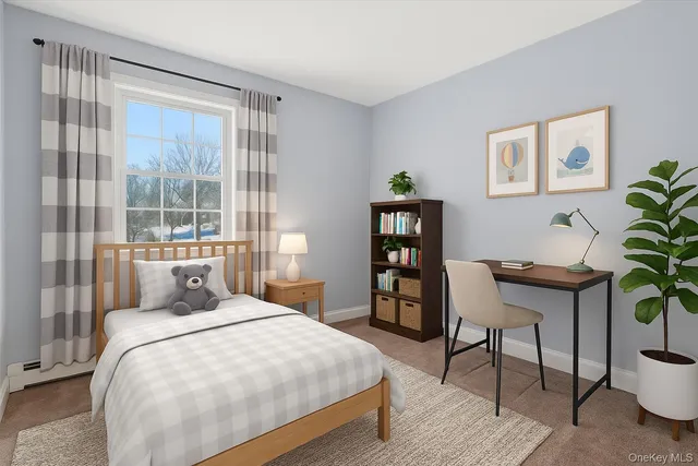 a bedroom with a bed a table and painting on the wall