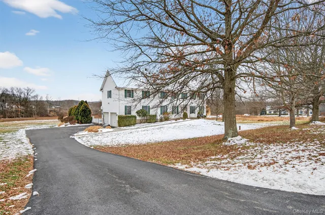 a view of a yard with a tree