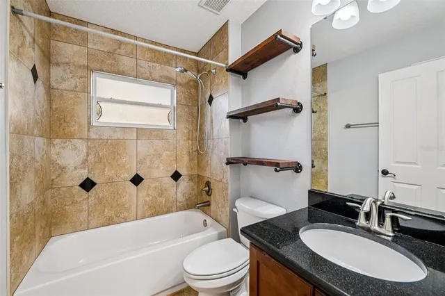 a bathroom with a sink toilet bathtub and shower