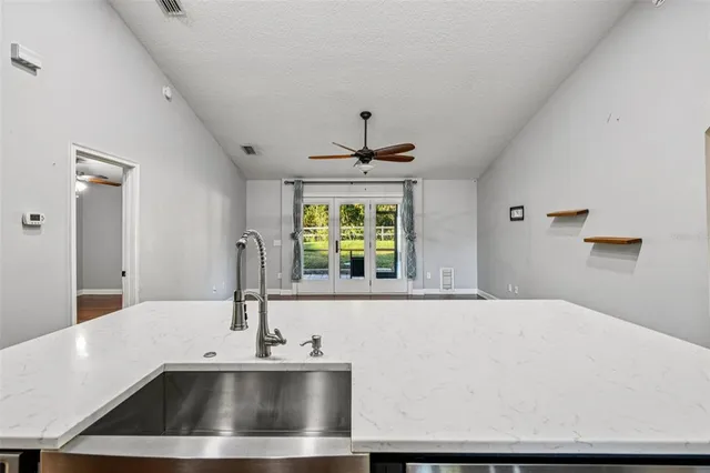 a bathroom with a sink and a large mirror