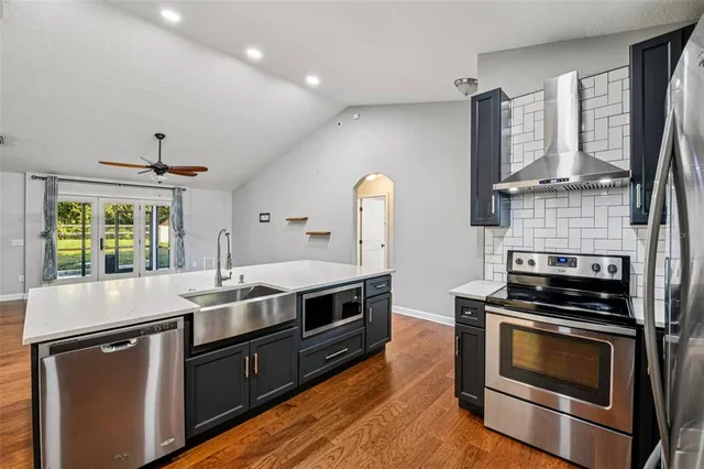 a kitchen with a stove and a sink